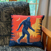 Our bigfoot throw pillow on a pattern chair