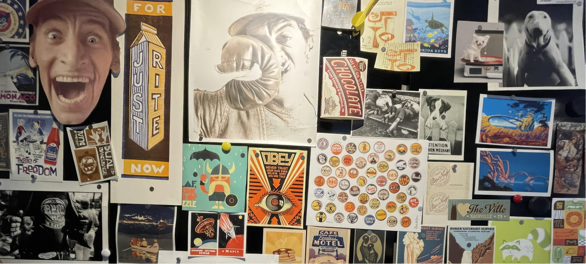 A studio wall covered in sketches, posters and collectibles