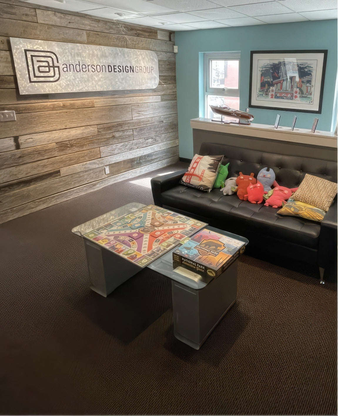 The ADG studio lobby with the logo on a wood wall